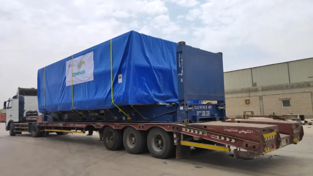 Covered cargo on a low-bed trailer
